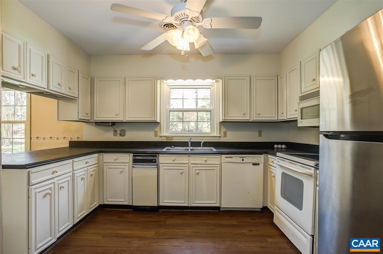 2711 Huntington Road Charlottesville, VA 22901 - Photo 2 of 39 a kitchen with white cabinets appliances and a window