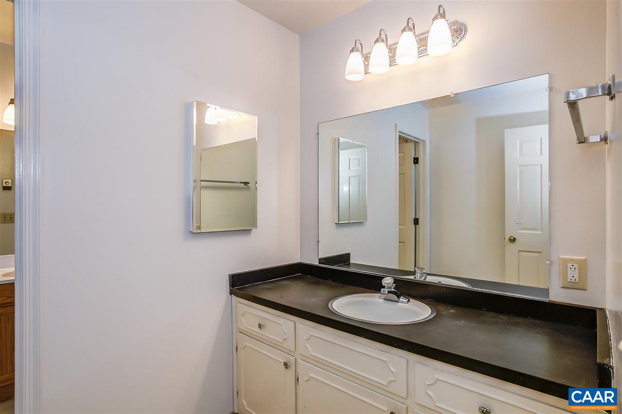 2711 Huntington Road Charlottesville, VA 22901 - Photo 24 of 39 a bathroom with a sink and a mirror
