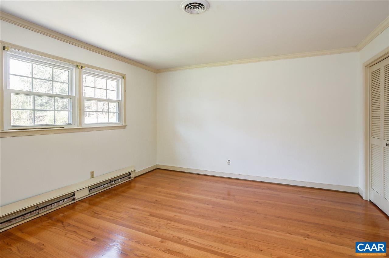 2711 Huntington Road Charlottesville, VA 22901 - Photo 26 of 39 an empty room with wooden floor and windows