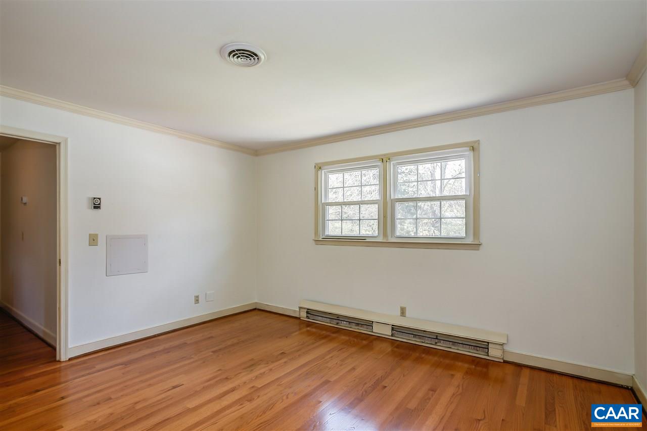 2711 Huntington Road Charlottesville, VA 22901 - Photo 27 of 39 an empty room with wooden floor and windows