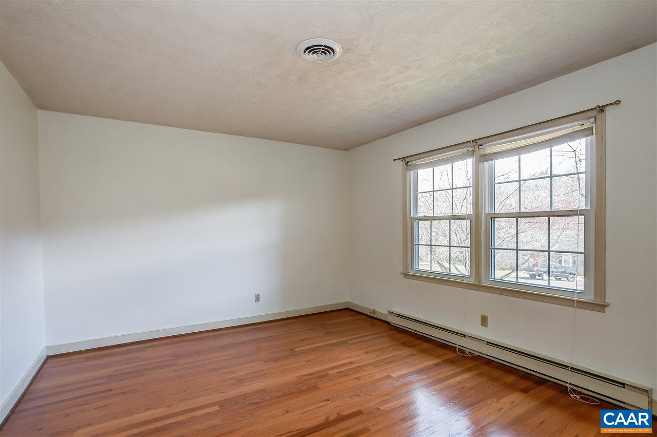 2711 Huntington Road Charlottesville, VA 22901 - Photo 28 of 39 an empty room with wooden floor and windows