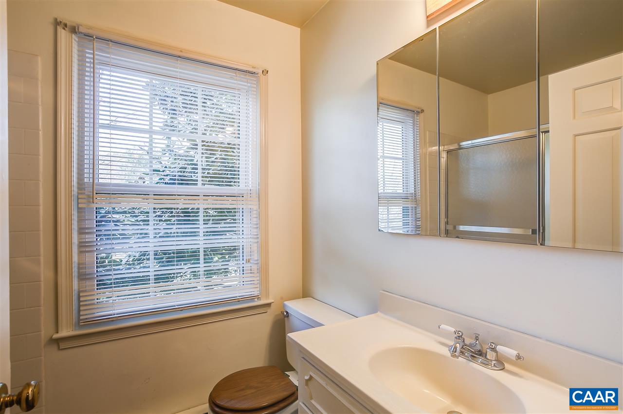 2711 Huntington Road Charlottesville, VA 22901 - Photo 30 of 39 a bathroom with a sink and a mirror