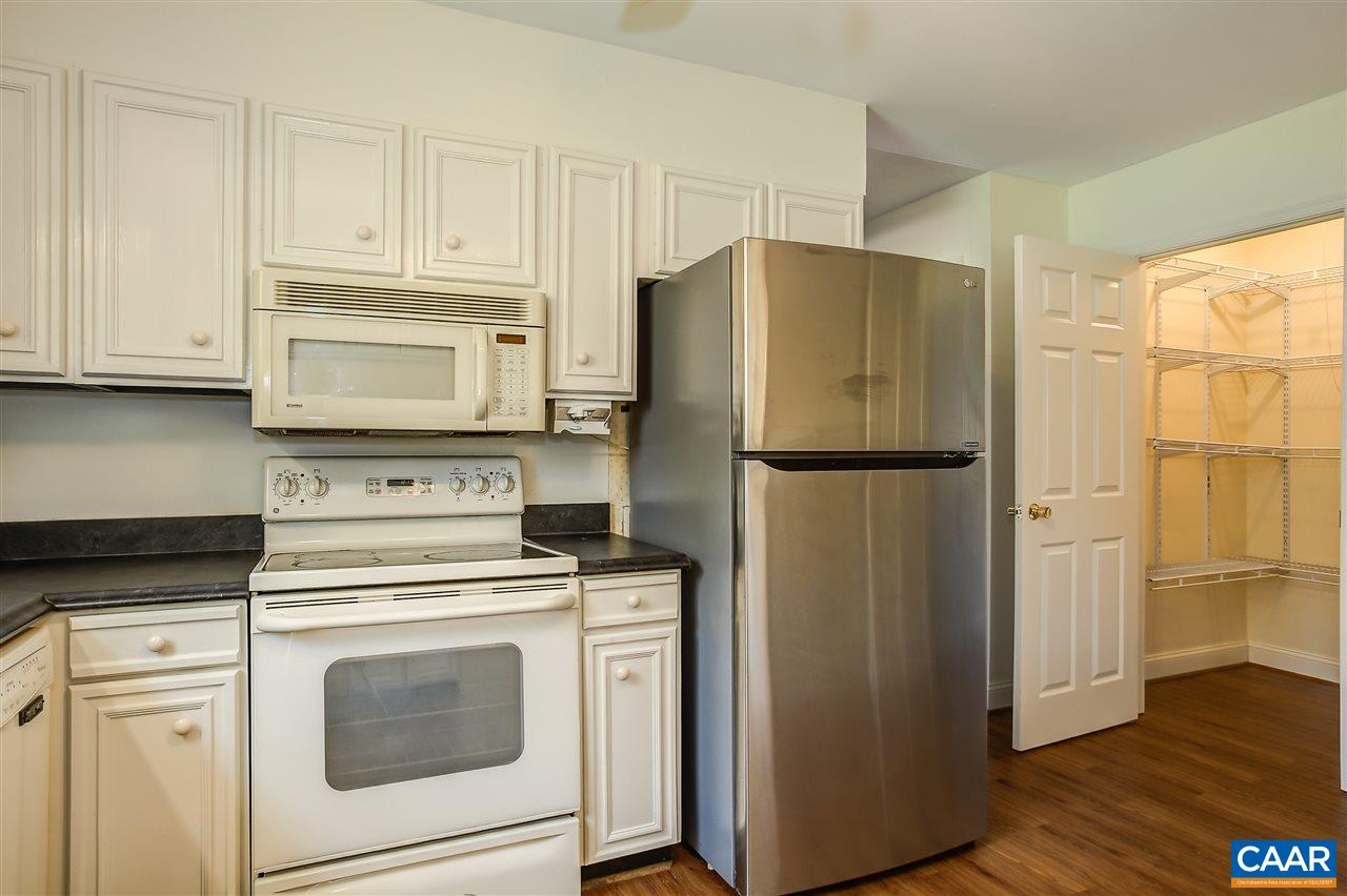 2711 Huntington Road Charlottesville, VA 22901 - Photo 3 of 39 a kitchen with refrigerator cabinets and wooden floor