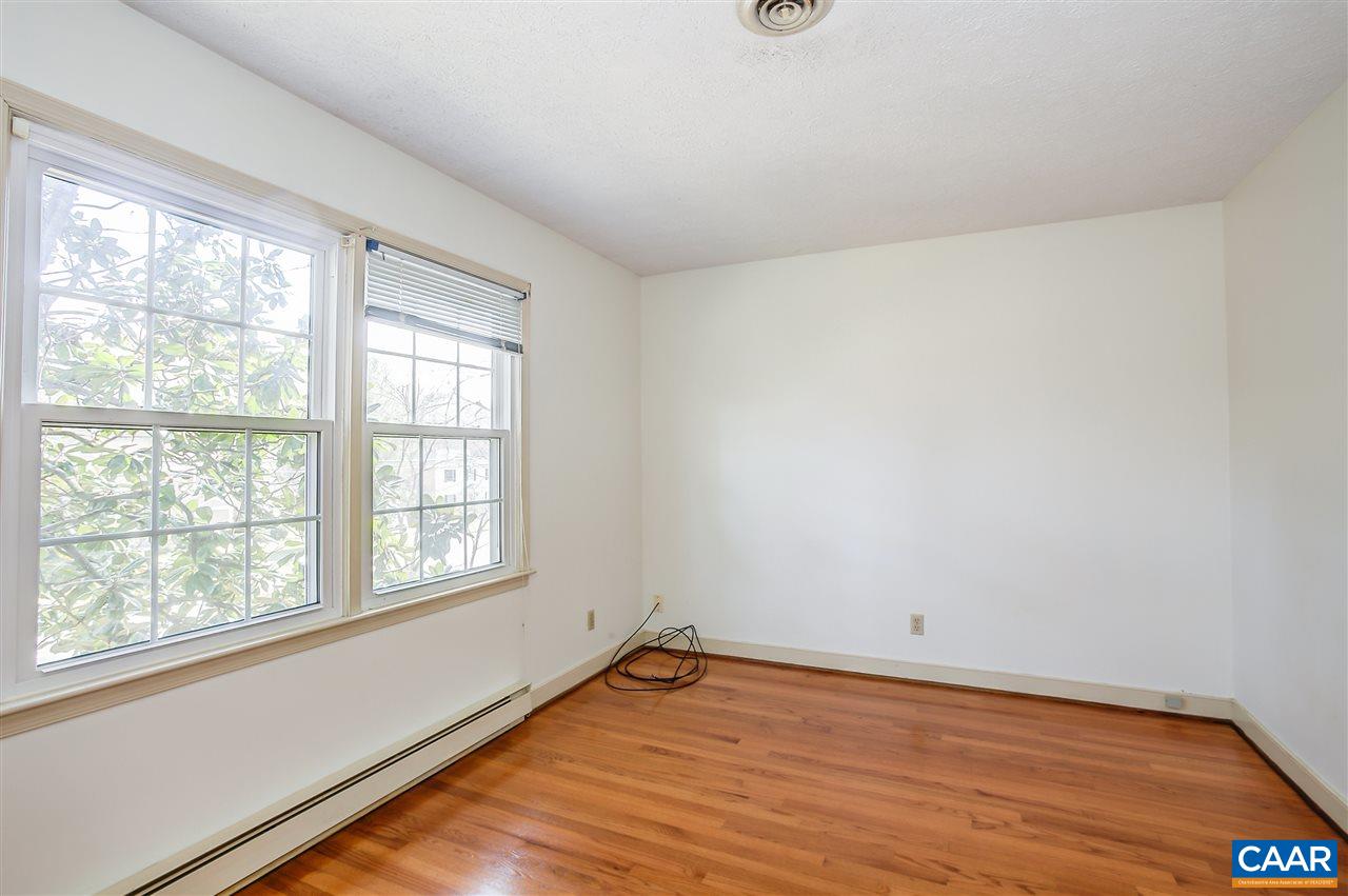 2711 Huntington Road Charlottesville, VA 22901 - Photo 31 of 39 an empty room with wooden floor and windows