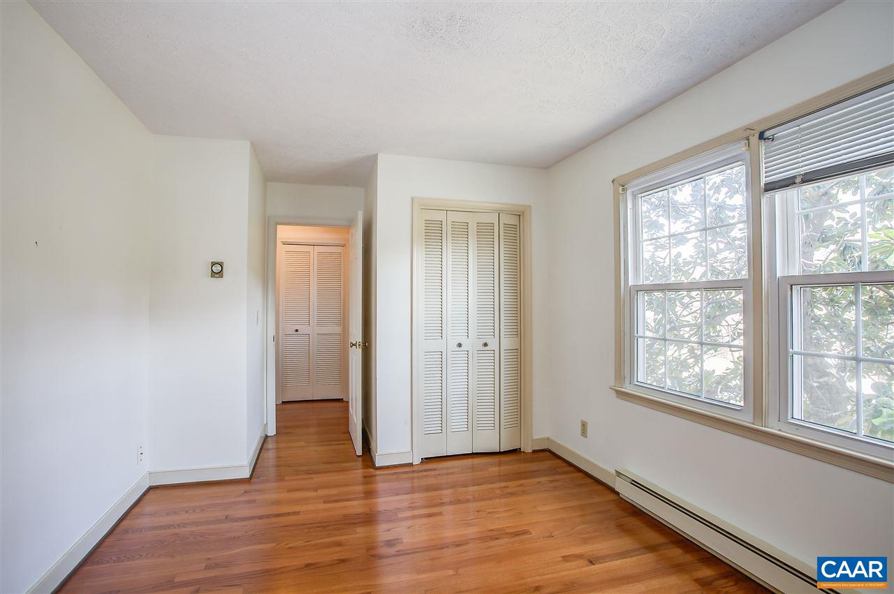 2711 Huntington Road Charlottesville, VA 22901 - Photo 32 of 39 a view of an empty room with wooden floor and a window