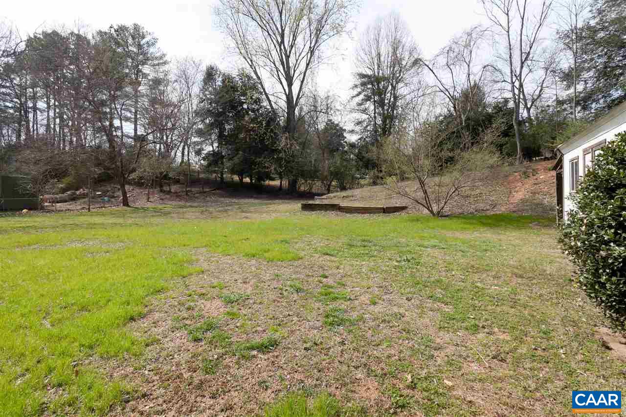 2711 Huntington Road Charlottesville, VA 22901 - Photo 37 of 39 a view of a swimming pool with an outdoor seating and a yard