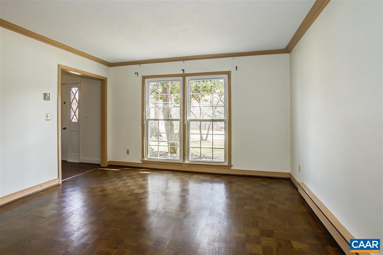 2711 Huntington Road Charlottesville, VA 22901 - Photo 9 of 39 a view of an empty room with wooden floor and a window