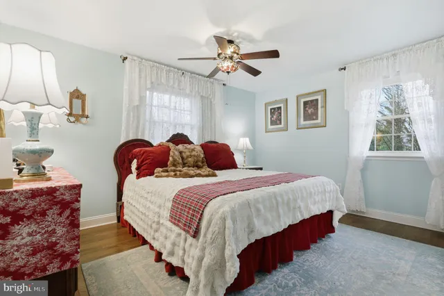 a bathroom with a granite countertop sink toilet tub and shower