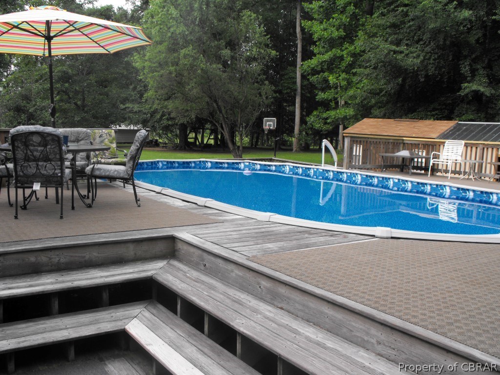 207 Windsor Road Dutton, VA 23050 - Photo 18 of 38 a view of a patio with chairs and a table