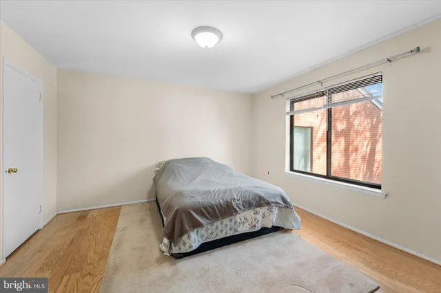 a room with a bed and a window