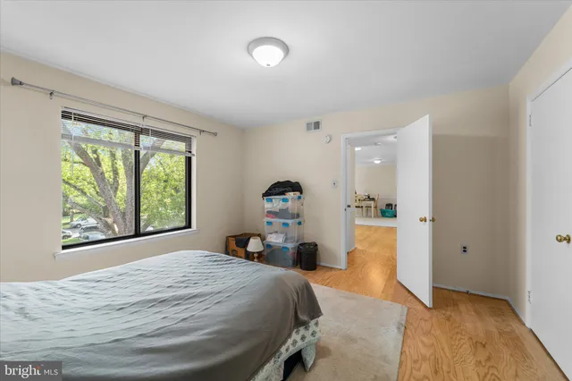 a bed room with a bed and a dresser