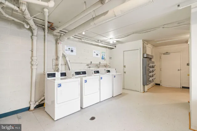 a view of a utility room with closet and windows