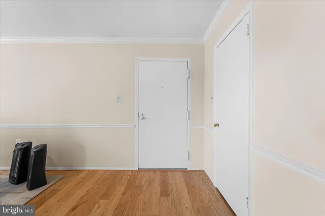 a view of a room with wooden floor