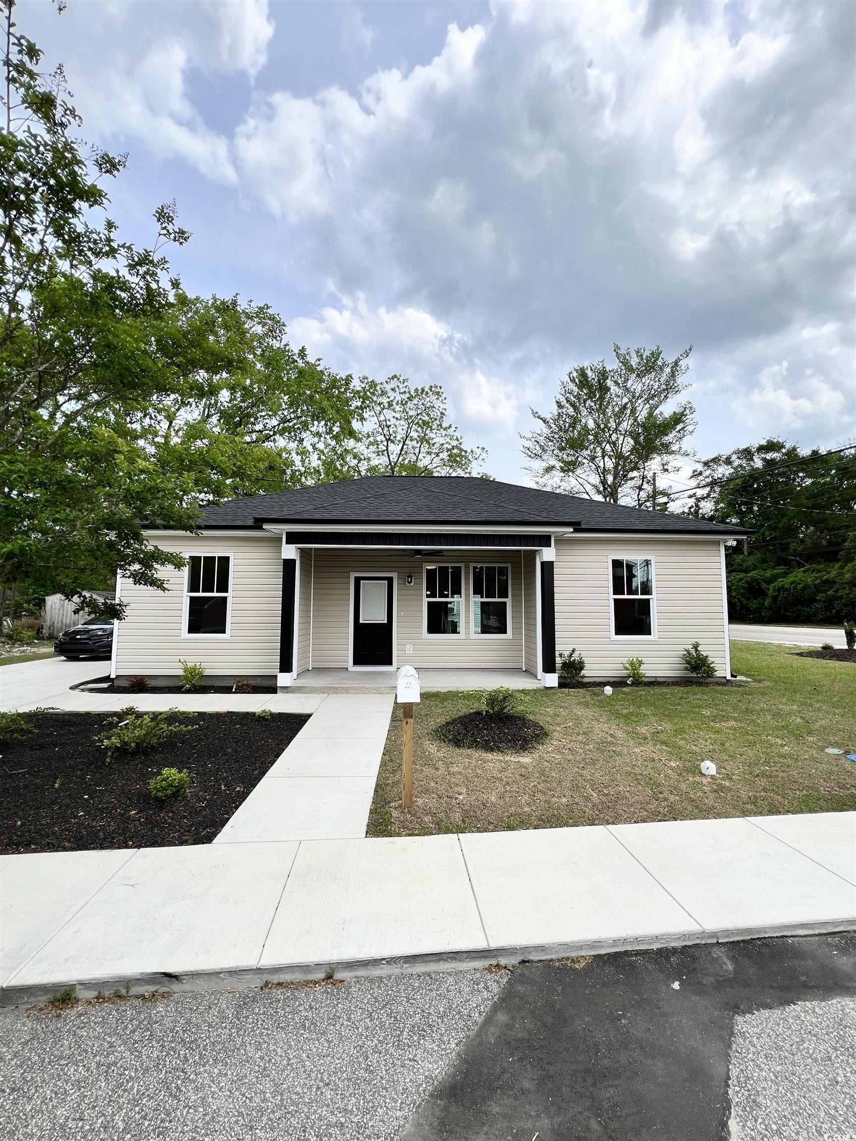 1795 Hemingway Street Conway, SC 29527 - Photo 20 of 29 Ranch-style house featuring covered porch and a front lawn