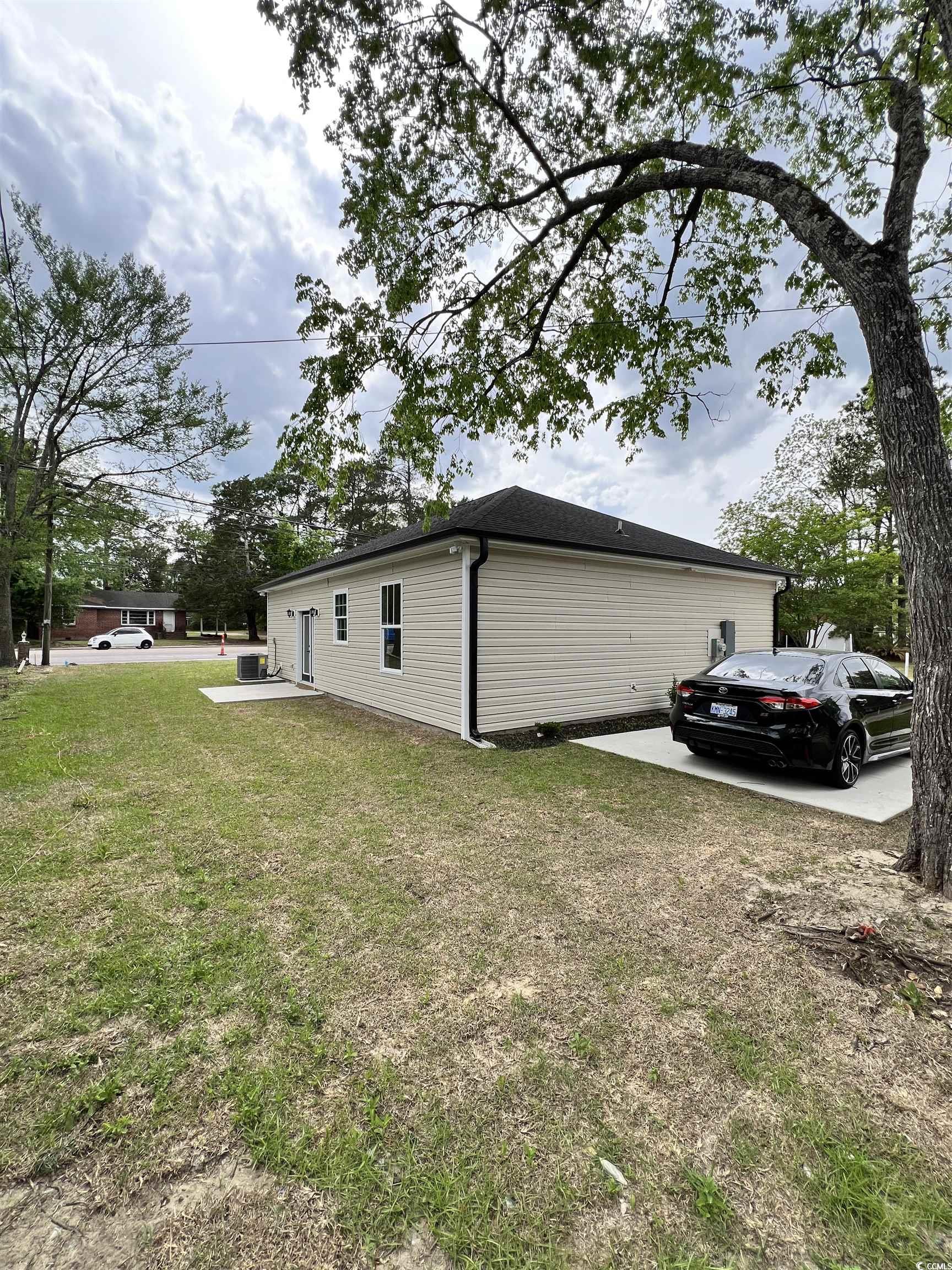 1795 Hemingway Street Conway, SC 29527 - Photo 22 of 29 View of side of home with a lawn and a patio area
