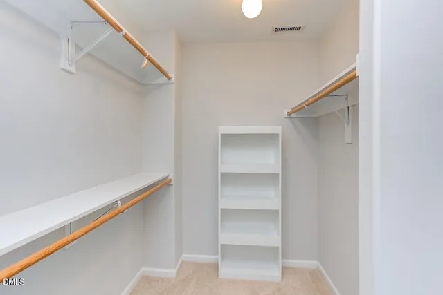 a view of an empty walk in closet