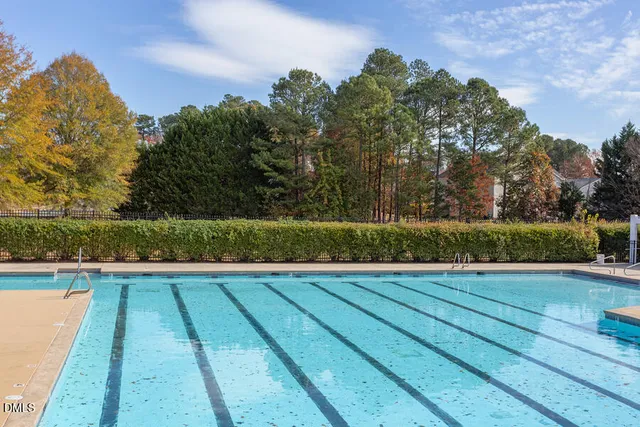 a view of swimming pool with wooden floor