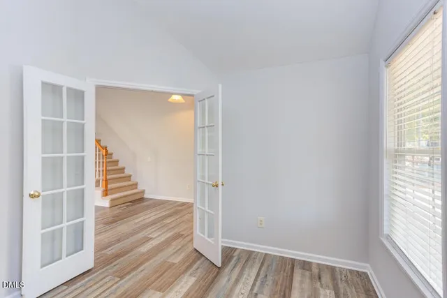 a view of entryway with wooden floor and window