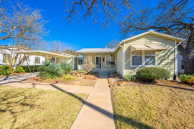 a view of a house with a swimming pool