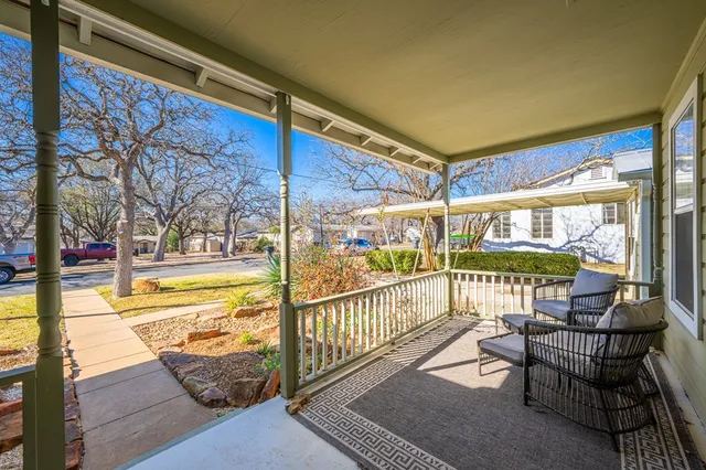 a view of a chairs and table in the balcony