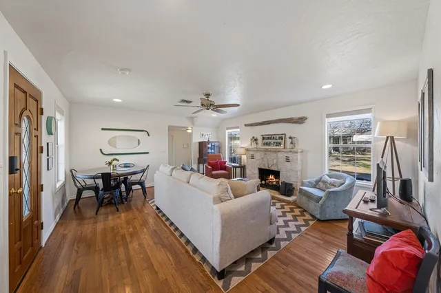 a living room with furniture fireplace and flat screen tv