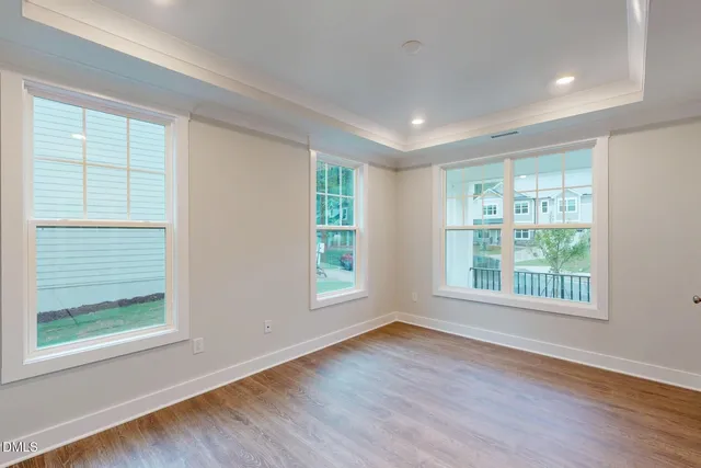 a kitchen with a stove sink and cabinets