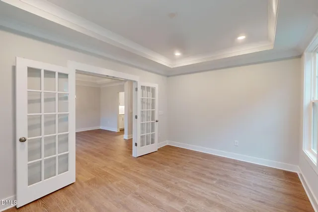 a large kitchen with kitchen island a sink stainless steel appliances and cabinets