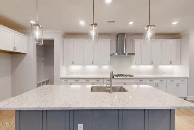 a view of kitchen with microwave and cabinets