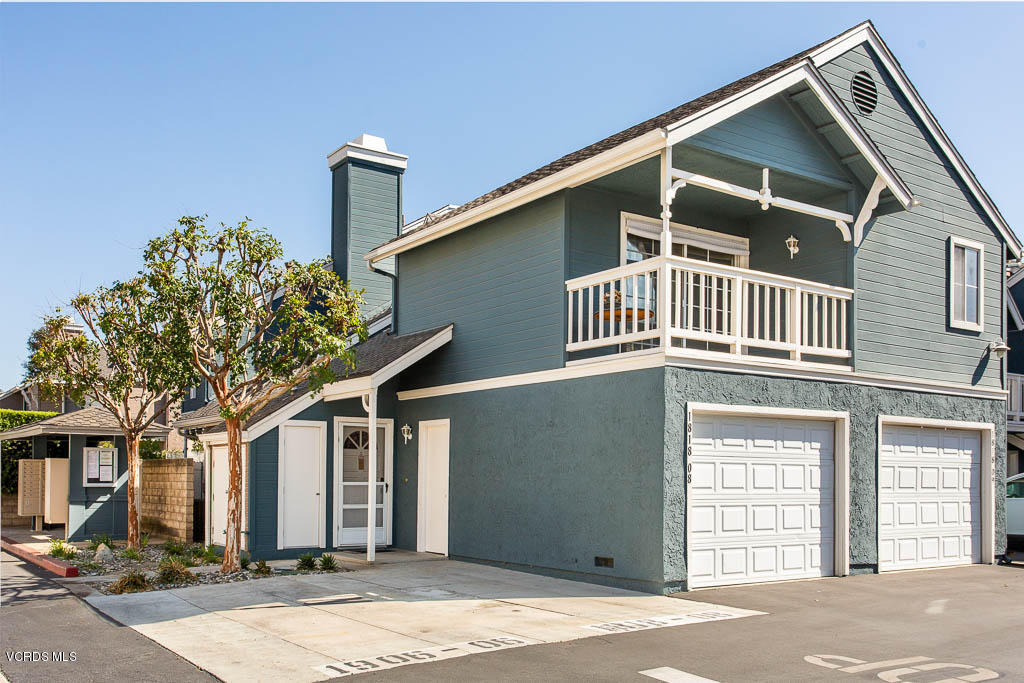 1818 Rory Lane, Unit 8 Simi Valley, CA 93063 - Photo 1 of 31 a front view of a house with a yard