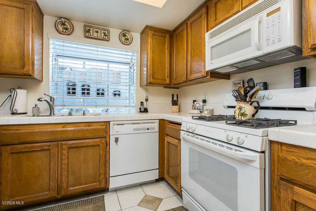 1818 Rory Lane, Unit 8 Simi Valley, CA 93063 - Photo 11 of 31 a kitchen with appliances cabinets and a sink