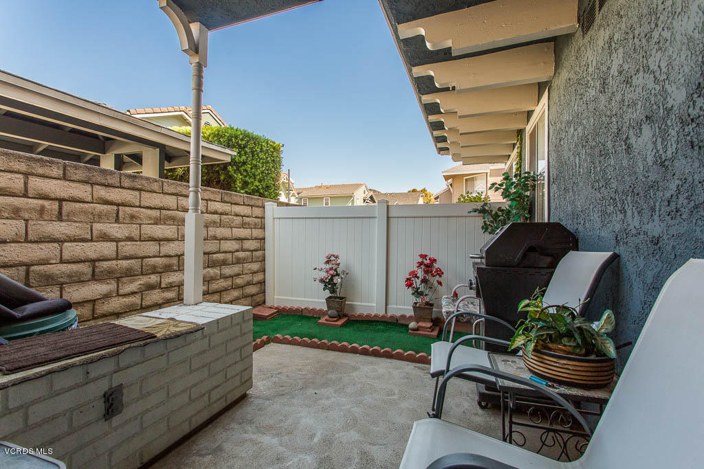1818 Rory Lane, Unit 8 Simi Valley, CA 93063 - Photo 13 of 31 a backyard of a house with outdoor seating