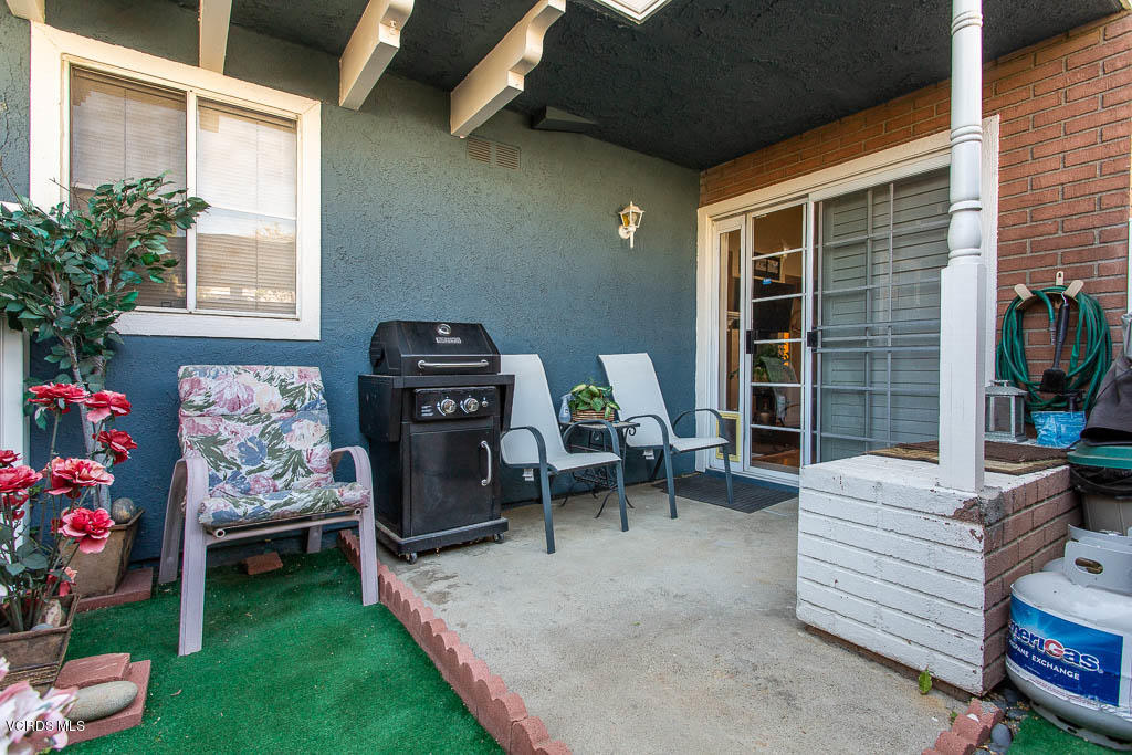 1818 Rory Lane, Unit 8 Simi Valley, CA 93063 - Photo 14 of 31 a view of a porch with chairs and a fire pit