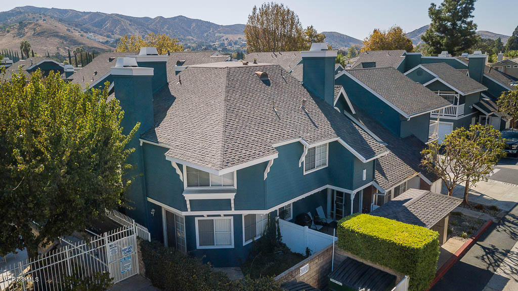 1818 Rory Lane, Unit 8 Simi Valley, CA 93063 - Photo 15 of 31 an aerial view of a house with swimming pool and trees