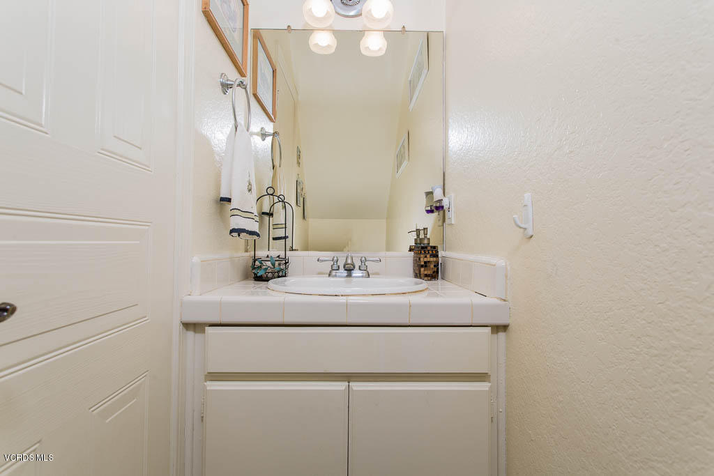 1818 Rory Lane, Unit 8 Simi Valley, CA 93063 - Photo 17 of 31 a bathroom with a sink and a mirror