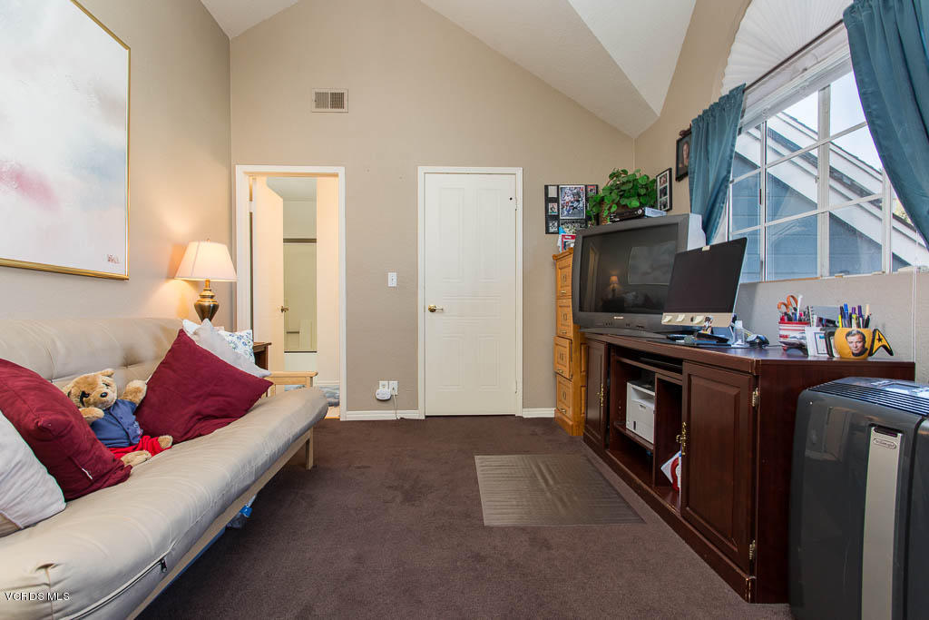 1818 Rory Lane, Unit 8 Simi Valley, CA 93063 - Photo 26 of 31 a living room with furniture and a fireplace