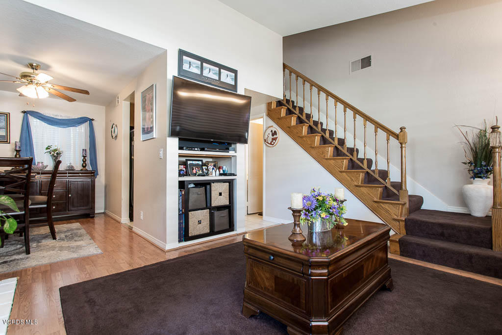 1818 Rory Lane, Unit 8 Simi Valley, CA 93063 - Photo 8 of 31 a living room with furniture and wooden floor