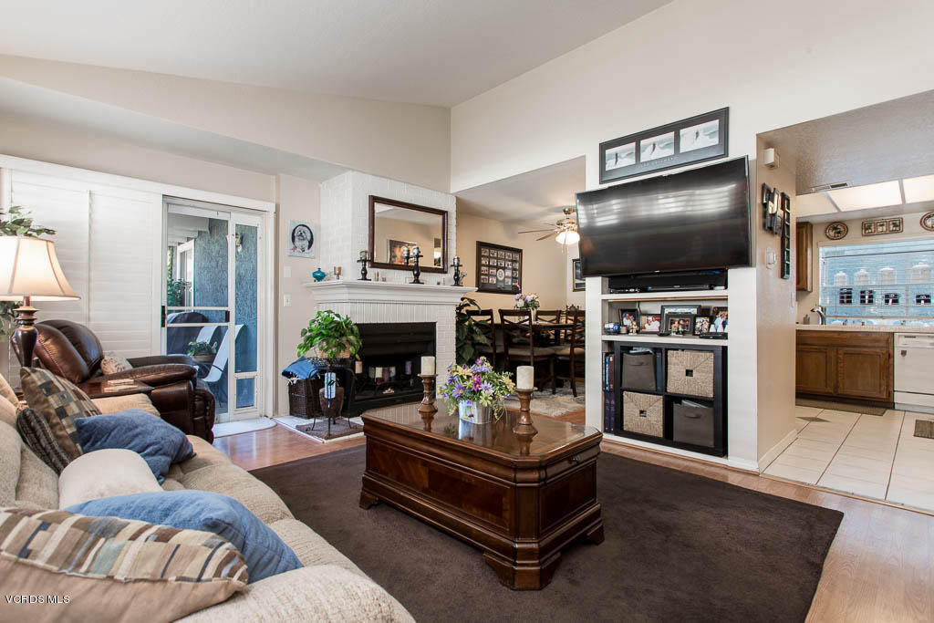 1818 Rory Lane, Unit 8 Simi Valley, CA 93063 - Photo 9 of 31 a living room with furniture and a flat screen tv