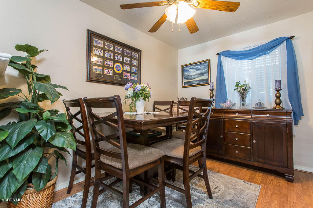 1818 Rory Lane, Unit 8 Simi Valley, CA 93063 - Photo 10 of 31 a view of a dining room with furniture and wooden floor