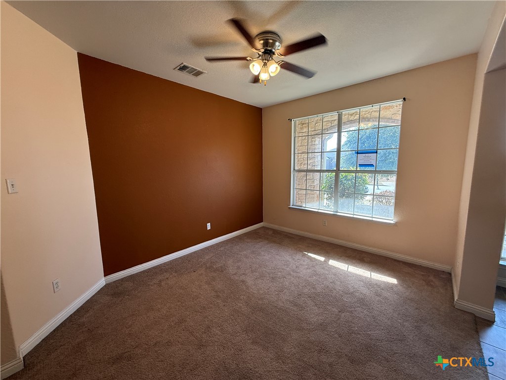 5607 Siltstone Loop Killeen, TX 76542 - Photo 12 of 48 an empty room with windows and fan