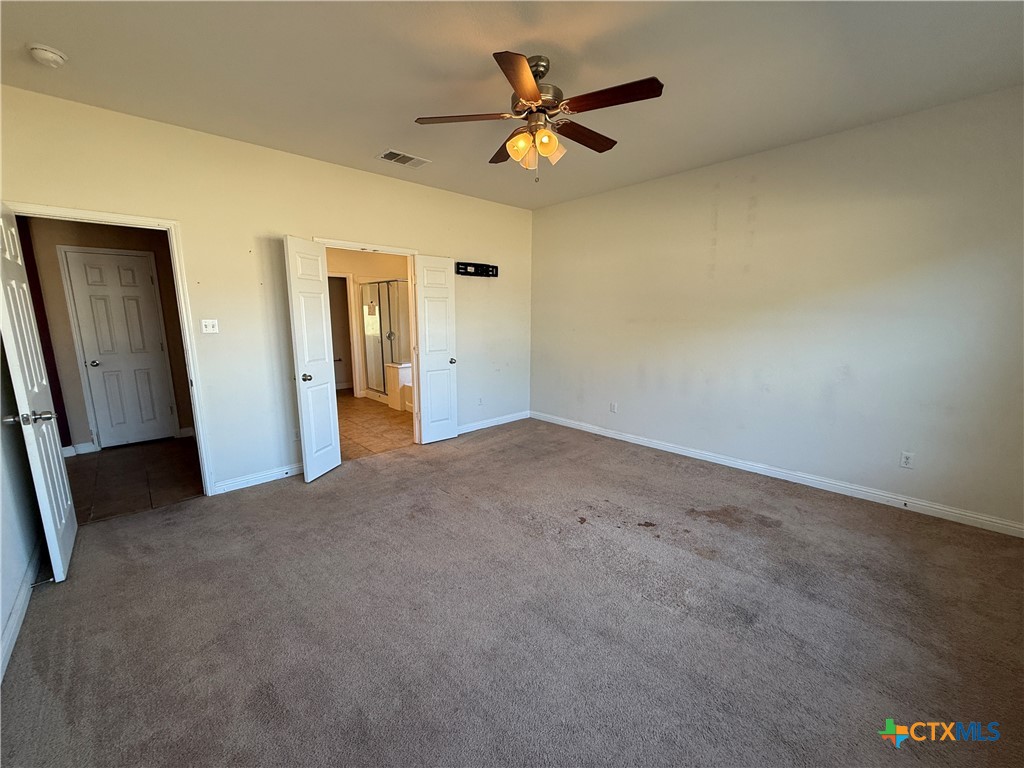 5607 Siltstone Loop Killeen, TX 76542 - Photo 17 of 48 a view of a livingroom with a ceiling fan and window