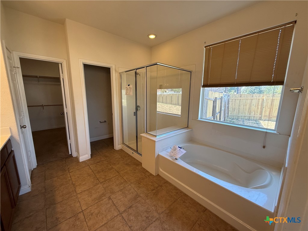 5607 Siltstone Loop Killeen, TX 76542 - Photo 21 of 48 a bathroom with a tub and a shower