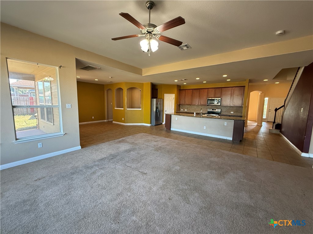 5607 Siltstone Loop Killeen, TX 76542 - Photo 4 of 48 a view of a kitchen with a stove and a refrigerator