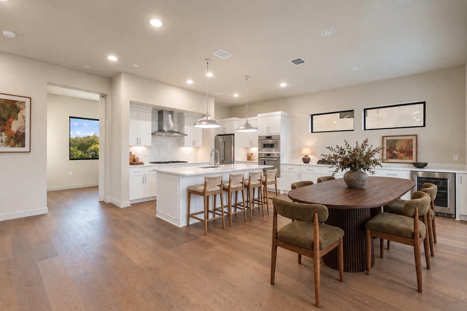 9803 Ribelin Ranch Court, Unit 16 Austin, TX 78750 - Photo 3 of 31 Gleaming hardwood floors and recessed lighting enhance this airy kitchen and dining area.