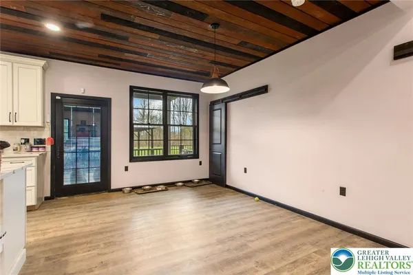 a view of an empty room with a window