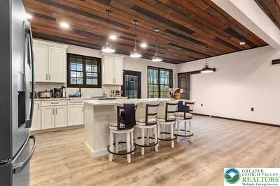 a kitchen with a sink cabinets and window