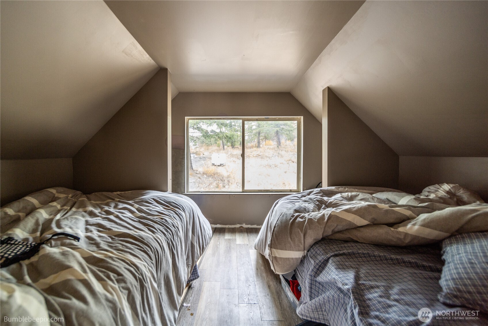 8 Camden Road Elk, WA 99009 - Photo 12 of 29 a bed sitting in a bedroom next to a window