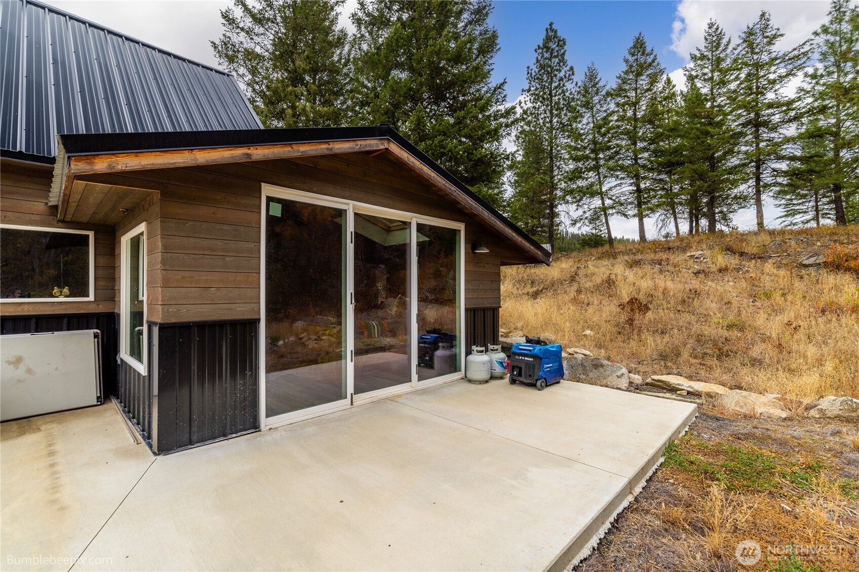 8 Camden Road Elk, WA 99009 - Photo 3 of 29 a view of a house with a yard and wooden fence