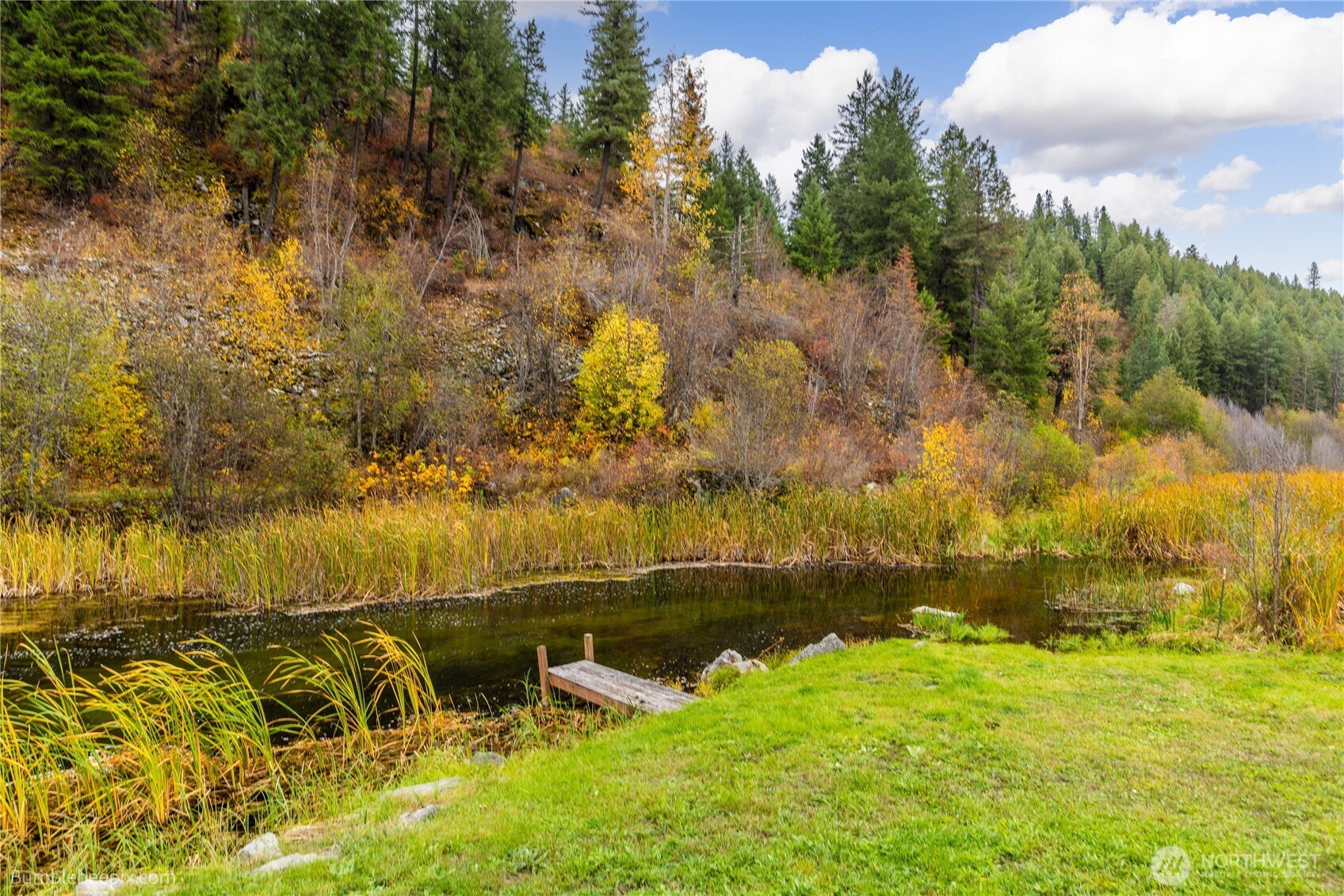8 Camden Road Elk, WA 99009 - Photo 5 of 29 a view of a lake with houses