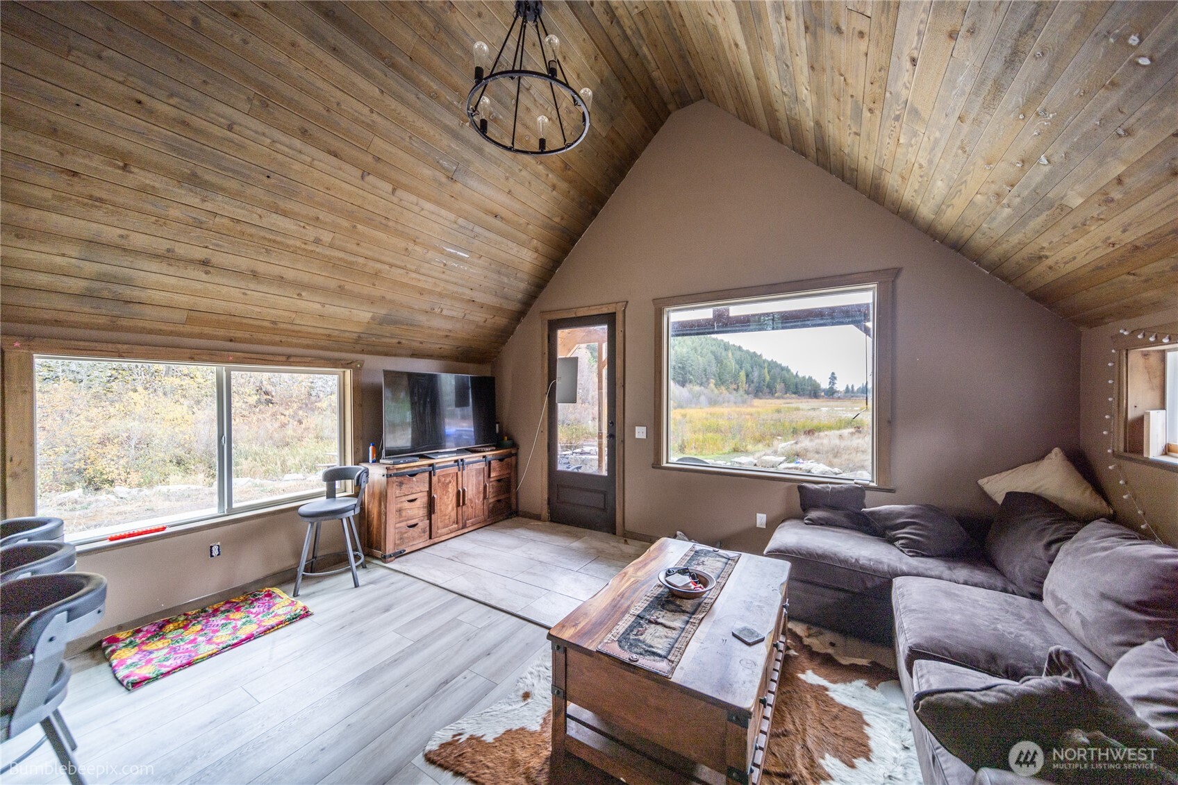 8 Camden Road Elk, WA 99009 - Photo 9 of 29 a living room with furniture and a large window