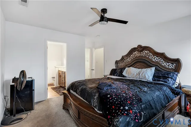 a bedroom with a bed and a dresser